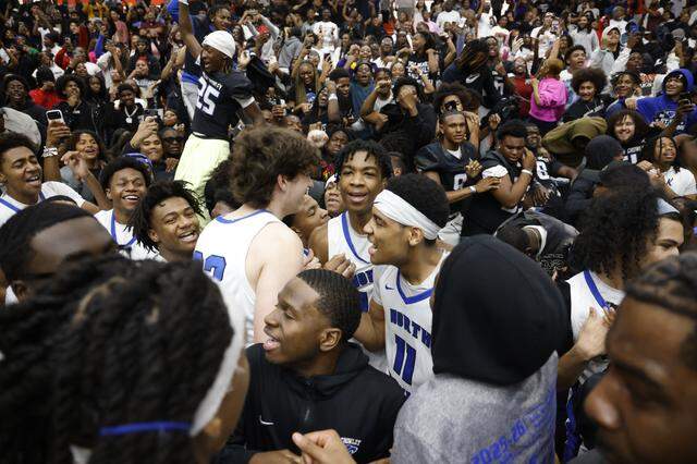 Players celebrated their win against Duncanville with fans and the football team during the second half of a UIL Class 6A Division I boys semifinal basketball game at Wilkerson-Greines Activity Center in Fort Worth, Texas, Monday, March 10, 2026.