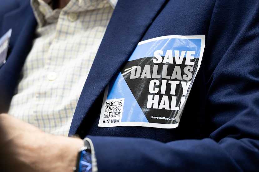 A “SAVE DALLAS CITY HALL” sticker worn by a speaker at last Wednesday's council hearing.