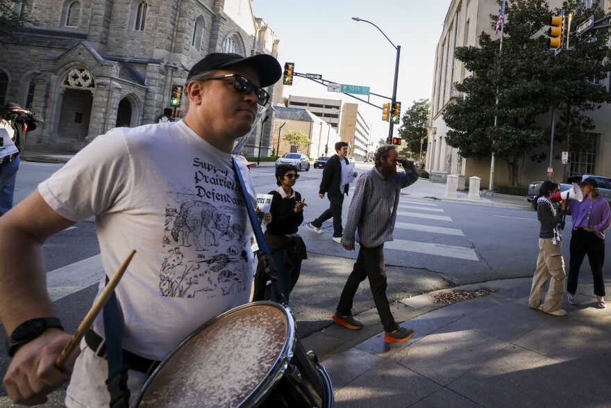 Supporters of the Prairieland ICE shooting defendants march outside the federal courthouse Wednesday, March 11, 2026, in Fort Worth.