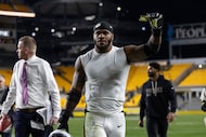 Green Bay Packers defensive end Micah Parsons (1) reacts after an NFL football game, Sunday,...