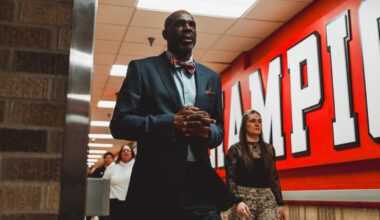 Snudda Collins and Bailey Maupin posing for the camera after a senior day winl.