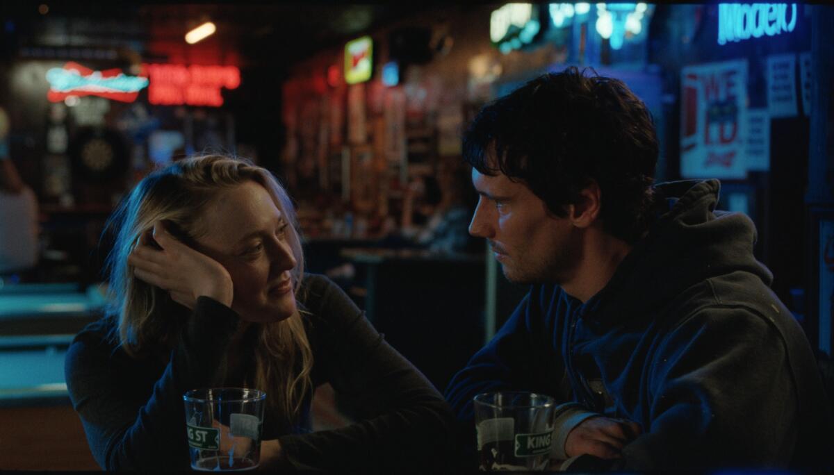 Dakota Fanning and Cory Michael Smith in 'The SUn Never Sets'