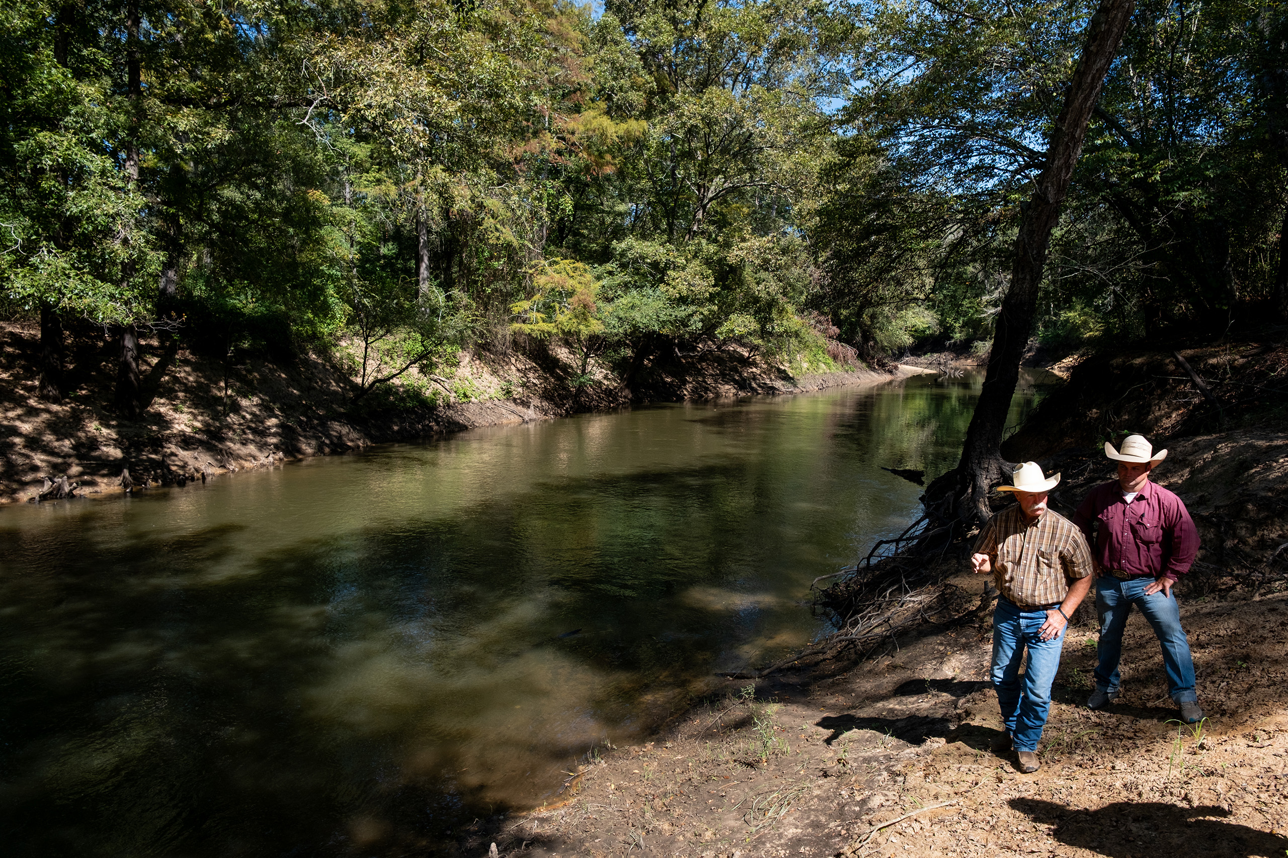 Bob Sanders and his son Dustin on the banks of Big Cypress Bayou on Oct. 9, 2025.