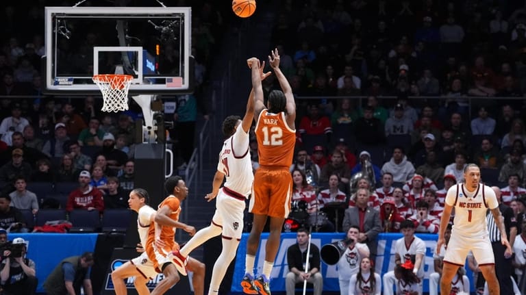 Texas guard Tramon Mark (12) scores a 3-point basket during...