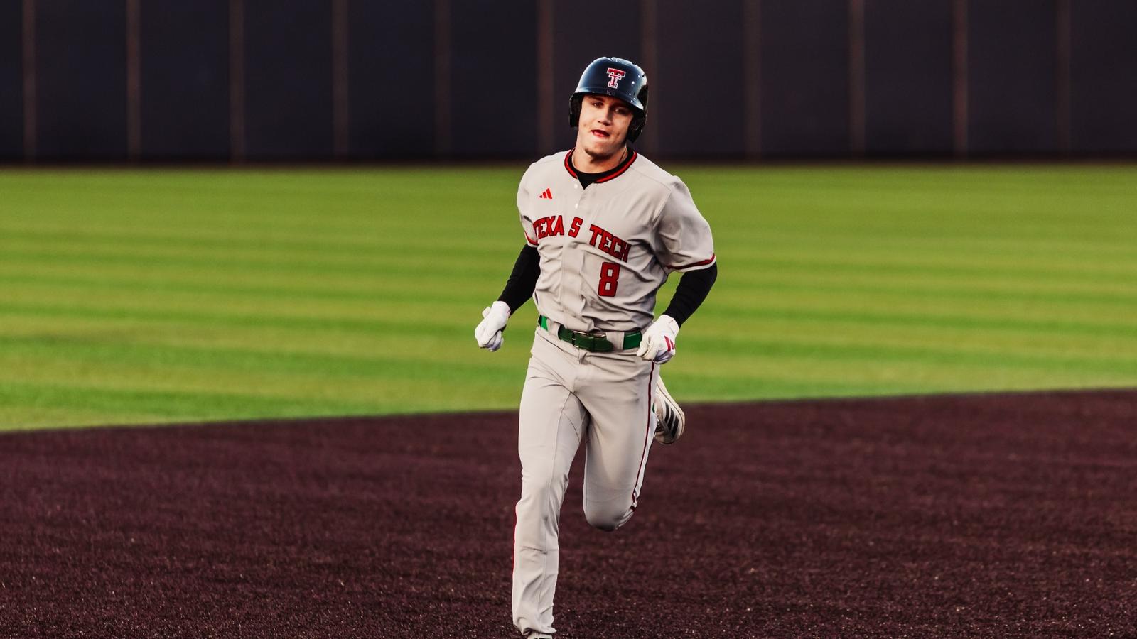 The Red Raider dugout erupts following Matt Quintanar's First Home Run as a Red Raider