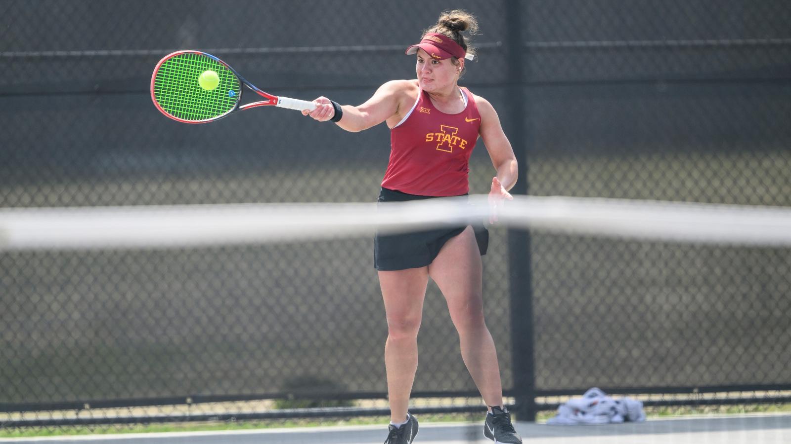 Alicia Dale takes a swing at practice.