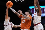 North Carolina State forward Darrion Williams (1) blocks the shot of Texas guard Jordan Pope...
