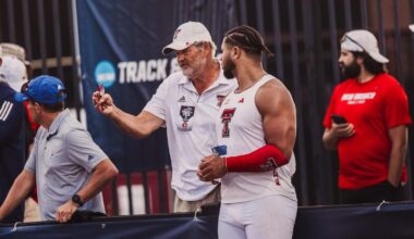 Wes Kittley takes a photo with national champions Jonathan Seremes (left) and Temitope Adehsina (right)