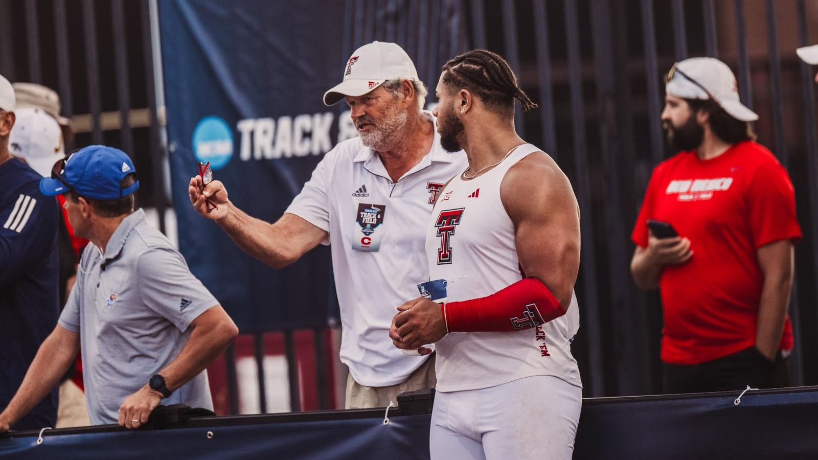 Wes Kittley takes a photo with national champions Jonathan Seremes (left) and Temitope Adehsina (right)