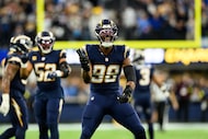 FILE - Los Angeles Chargers linebacker Odafe Oweh (98) gestures during an NFL football game...