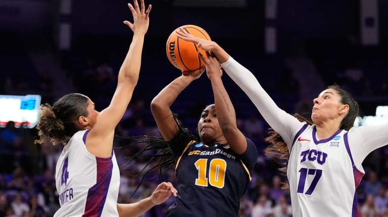 UC San Diego guard Dymonique Maxie (10) shoots as TCU's...