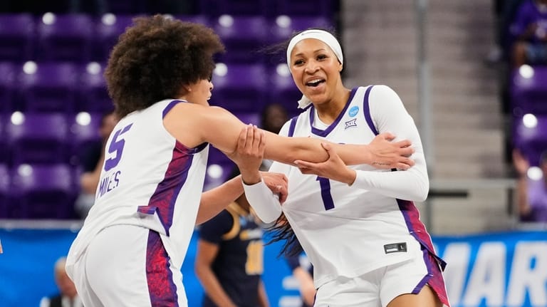 TCU's Olivia Miles (5) and Taylor Bigby (1) celebrate a...