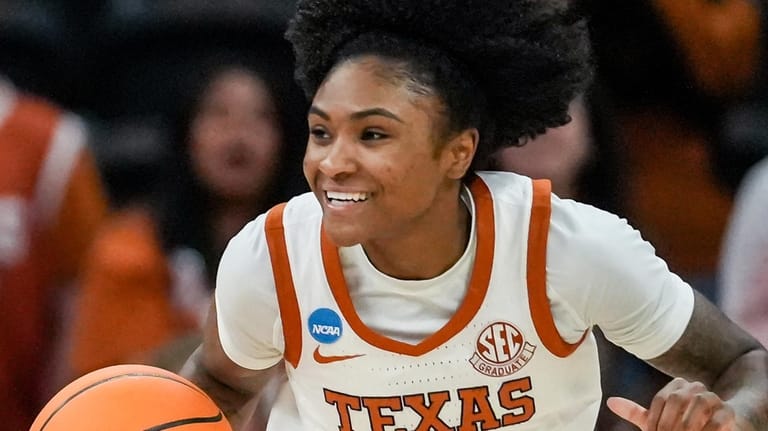 Texas guard Rori Harmon dribbles down the court during the...