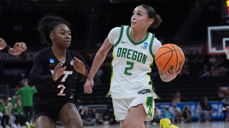 Oregon guard Katie Fiso, right, drives against Virginia Tech guard...