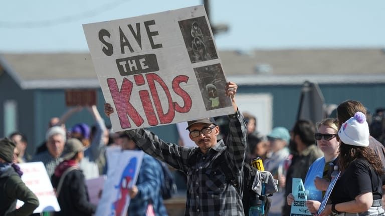 Protesters gather outside the South Texas Family Residential Center detention...