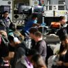 Passengers wait in line for a Transportation Security Administration checkpoint while traveling at Los Angeles International Airport November, 2025.