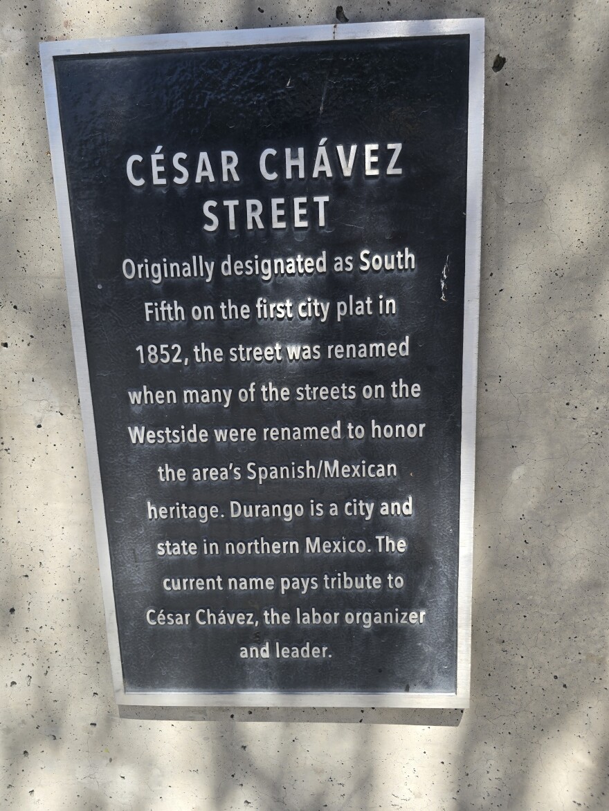Plaque hangs over the San Pedro Creek on Cesar E. Chavez Boulevard