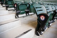 The Texas Rangers logo is on each row of seats at Globe Life Field in Arlington, Texas, on...