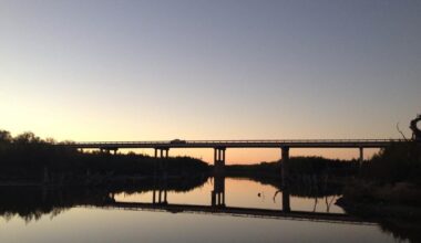 John Rivenburgh shows off two of the 3,000-gallon tanks in his warehouse as he walks through his Bending Branch vineyard and wine producing plant near Comfort on Nov. 20, 2014. 