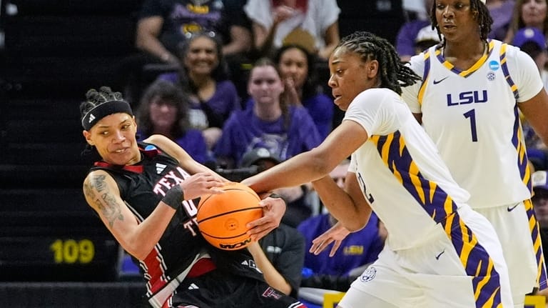 Texas Tech guard Snudda Collins (0) battles for control against...