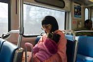 Dallas resident LaCora Clayton-Allen rides the DART with her two-year-old daughter, Lahna,...