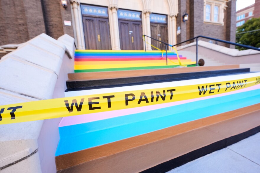 The front steps that lead into Oak Lawn United Methodist Church have tape around them warning of the fresh paint on the steps, Tuesday, Oct. 28, 2025, in Dallas. (AP Photo/Tony Gutierrez)