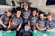 Seven Dallas Stars players pose for a photo on the team's plane wearing matching "Ella's...