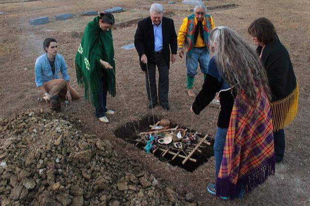 Eddie Sandoval, fourth from left, oversees the burial of a young Native American woman’s remains at Oakwood Cemetery on Dec. 21, 2017. The woman is believed to have lived more than 1,000 years ago. From left are Austin Baker, Kui Red Eagle of Oklahoma, Jim Lane of Fort Worth, Sandoval, Mary Red Eagle of Oklahoma and Dana Austin of the Tarrant County Medical Examiner's office.