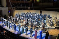Singers, Dallas Symphony Orchestra and music director Fabio Luisi take bows after...