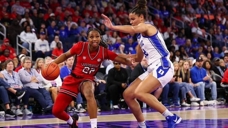 Louisville guard Tajianna Roberts (22) dribbles against Duke forward Delaney...