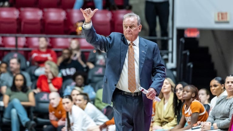 Texas head coach Vic Schaefer signals to his players during...