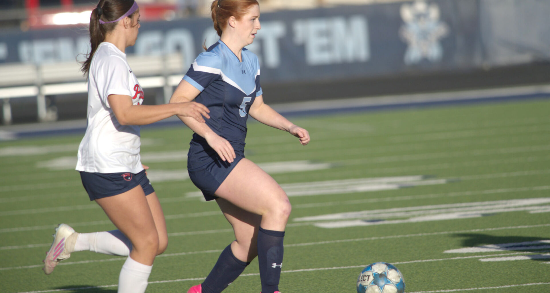 Greenwood's Emily Jones dribbles the soccer ball while being defended by Lubbock-Cooper Liberty's Amelia Martinez, Feb. 24, 2026, at J.M. King Memorial Stadium. 