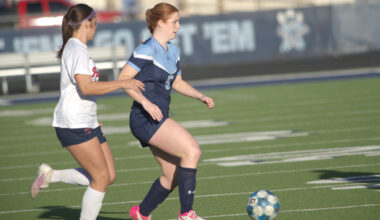 Greenwood's Emily Jones dribbles the soccer ball while being defended by Lubbock-Cooper Liberty's Amelia Martinez, Feb. 24, 2026, at J.M. King Memorial Stadium. 