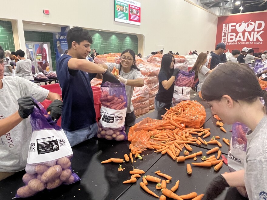 San Antonio Food Bank volunteers in the new, enclosed warehouse
