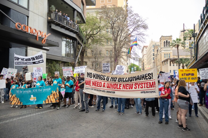 The 50501 and Party for Socialism and Liberation organizations lead the No Kings protest crowd through the streets of downtown San Antonio on March 28, 2026