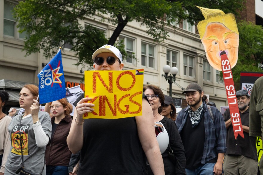 No Kings protest demostrators march along N St. Mary's Street on March 28, 2026