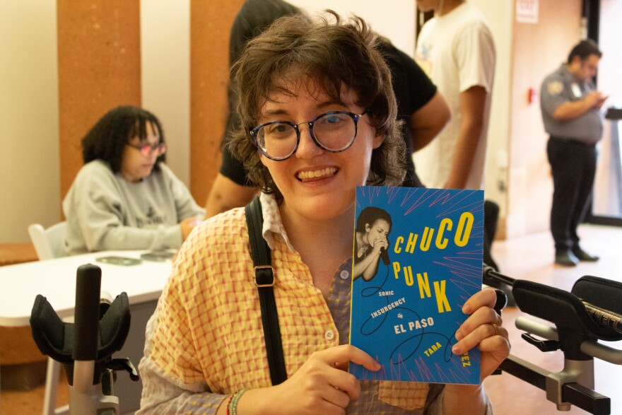 Chiara Pride after Tara Lopez's talk with her newly purchased book.