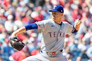 Texas Rangers pitcher MacKenzie Gore throws in the first inning of a baseball game against...