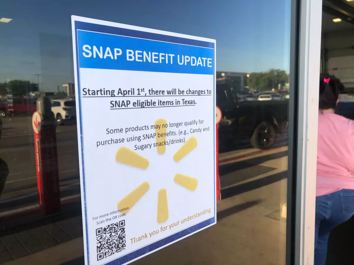 A sign outside a Walmart that reads 'SNAP benefit update: Starting April 1, there will be changes to SNAP eligible items in Texas.'