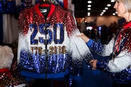 Patricia Gordon arranges sequin jackets in the exhibit hall during the Conservative...