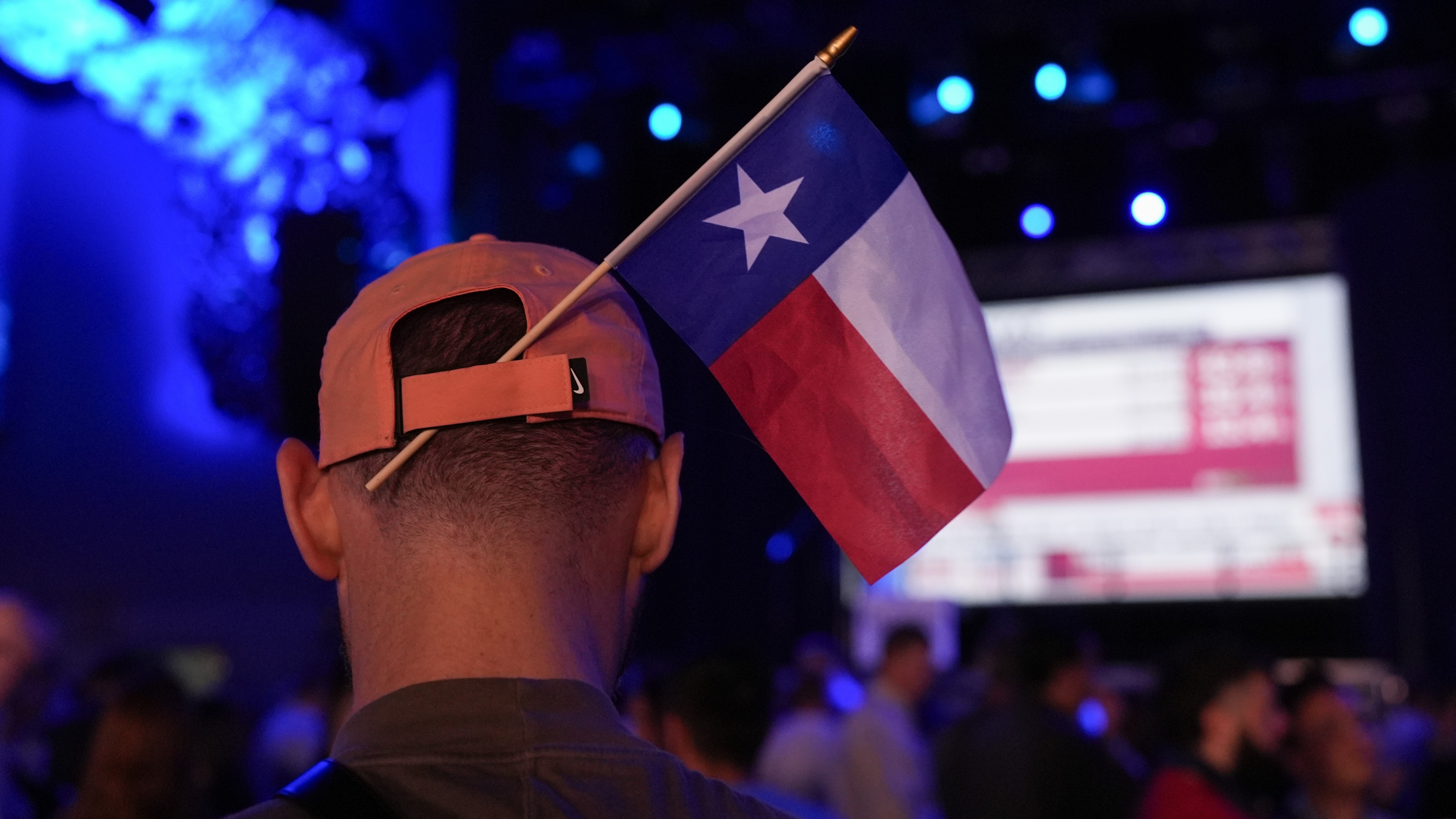 A supporter of Texas state Rep. James Talarico, D-Austin, wears a Texas state flag in their hat during a primary election watch party Tuesday, March 3, 2026, in Austin, Texas.
