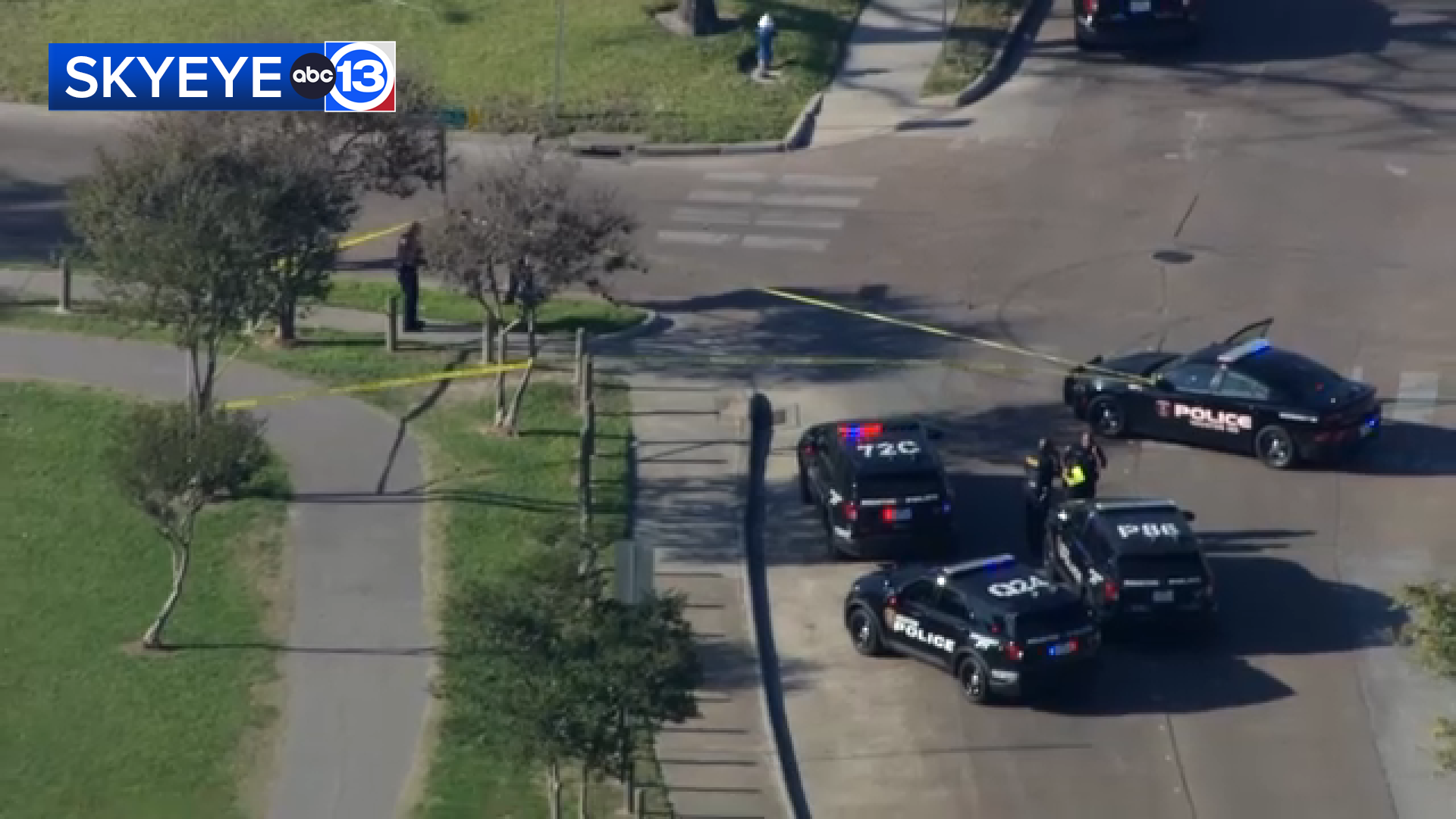 SkyEye was over the active scene, showing yellow police tape near the bus, which was stopped next to a park.