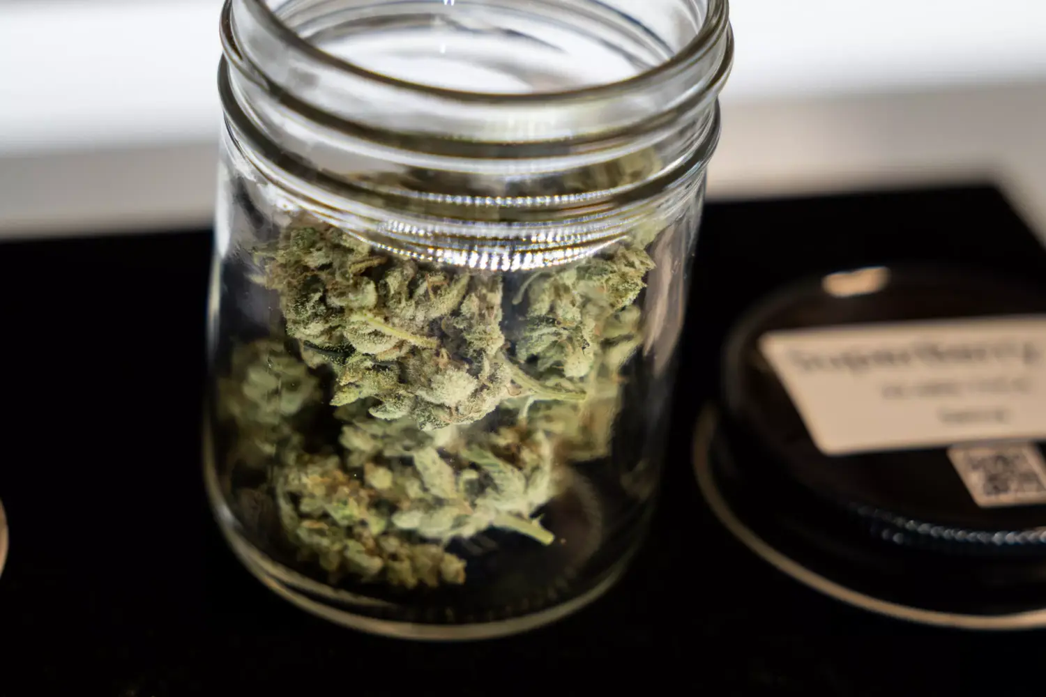 A jar of ATX Organics THCA hemp flower is pictured on Wednesday, Aug. 27, 2025, at ATX Organics in Austin.