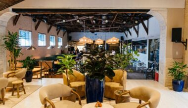 The transformed indoor dining room at Meraki now boasts a horseshoe bar near the entrance, hanging woven light fixtures throughout, overhead netting, and other light coastal touches. (Courtesy)