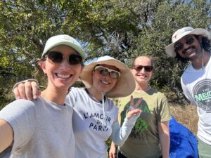 Team of researchers pose for photo outdoors while testing plant tattoo sensor. 
