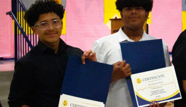 Jose (Tony) and Angel holding up their honors at the board meeting in Anthony.