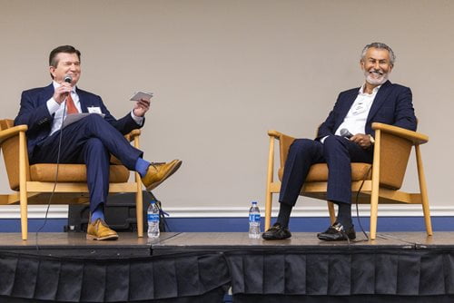 Harry Dombroski and Sam Mahrouq sit across from one another. 