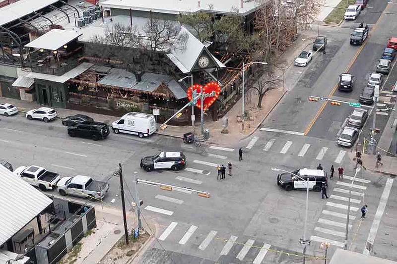 Police investigate the site of a shooting at Buford's in Austin, Sunday, March 1, 2026. (Aaron E. Martinez/Austin American-Statesman via AP)