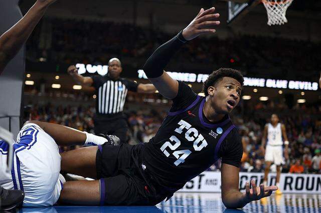 GREENVILLE, SOUTH CAROLINA - MARCH 21: Xavier Edmonds #24 of the Texas Christian University Horned Frogs reacts to being called for a foul against the Duke Blue Devils during the second half in the second round of the 2026 NCAA Men's Basketball Tournament at Bon Secours Wellness Arena on March 21, 2026 in Greenville, South Carolina. (Photo by Jared C. Tilton/Getty Images)