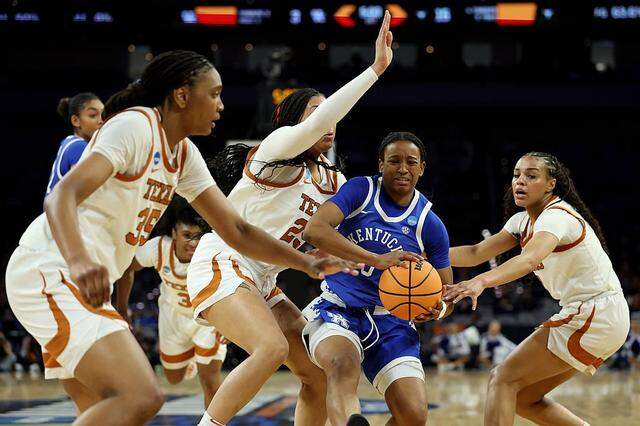 FORT WORTH, TEXAS - MARCH 28: Madison Booker #35, Breya Cunningham #25 and Jordan Lee #7 of the Texas Longhorns defend against Jordan Obi #0 of the Kentucky Wildcats during the first quarter in the Sweet Sixteen of the 2026 NCAA Women's Basketball Tournament at Dickies Arena on March 28, 2026 in Fort Worth, Texas. (Photo by Elsa/Getty Images)